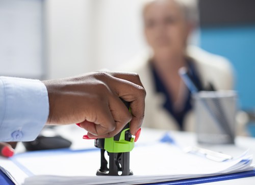 A stamp being applied to a document